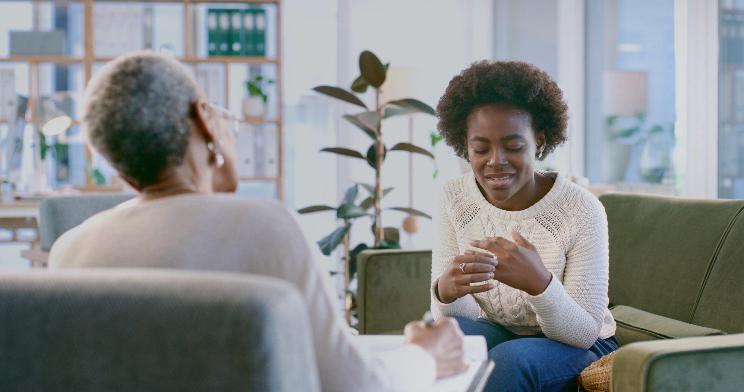 Supportive counseling session in a calm therapy office